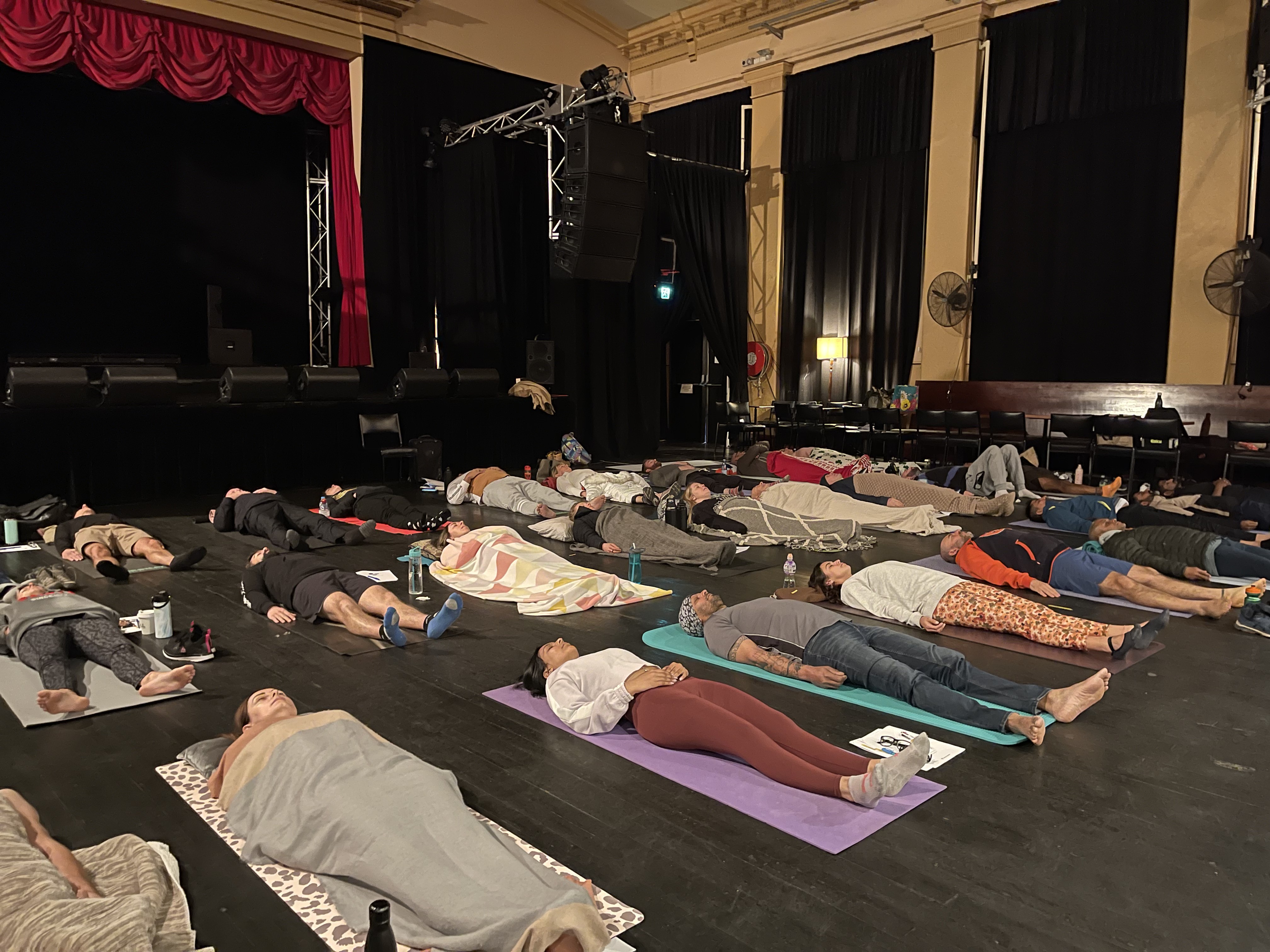 Participants in a guided breathwork journey led by Haran Singham